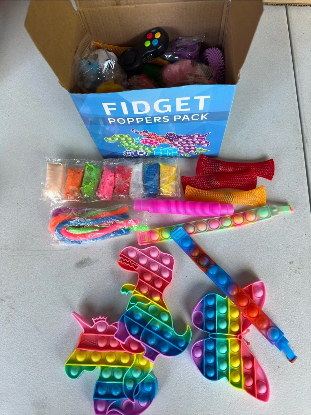 Opened to show contents inside! Rainbow Kids Fidget Toy Pack - Multicolor Popper